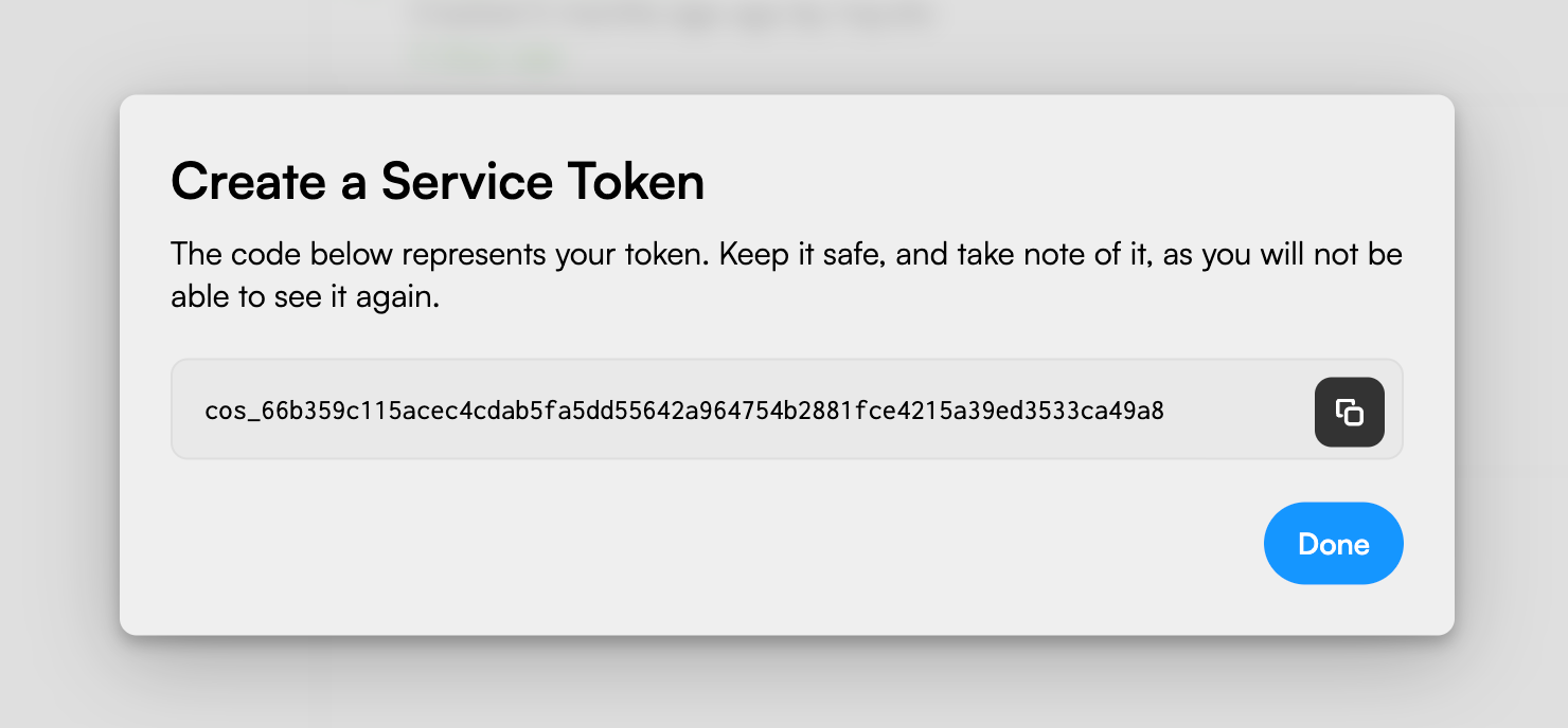 The Create a Service Token dialog showing the value of the created token